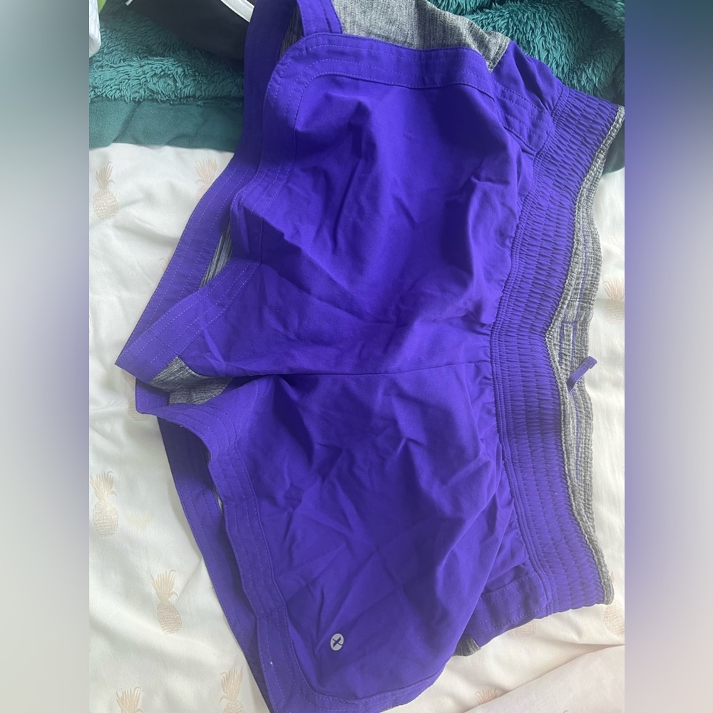 Purple athletic shorts with attached undershirt